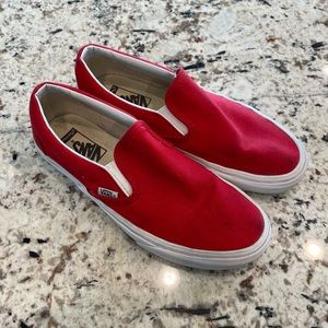 Red slip-on Vans sneakers